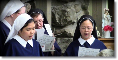 Four Sisters singing in choir