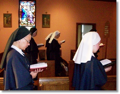 Sisters praying Liturgy of the Hours in chapel
