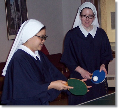 Two Sisters playing ping pong